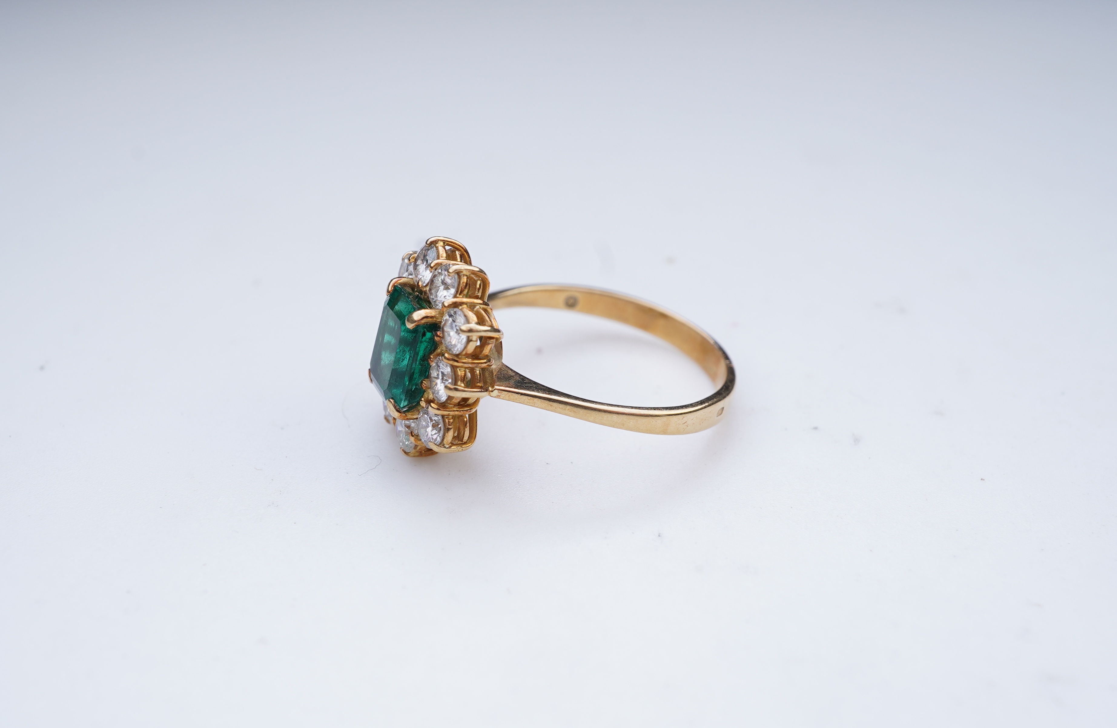 A synthetic emerald and diamond ring